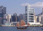 An ancient style sailing junk crosses Hong Kong's Victoria Harbor
