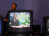 Scott playing weatherman at Applied Arts Museum