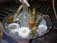 A sampling of local treats - Dom and Yenson drinks, and apple tobacco in a water pipe