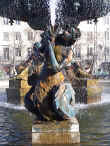 A worn, but graceful fountain statuette in Rossio Square