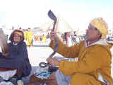 A snake charmer and his 'dance partner'