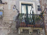 The wrought iron balconies of Sicily's streets