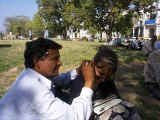 Laura getting her ears cleaned in Delhi's Connaught Place