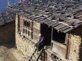 Nepalese villager watching the world go by from his front stoop