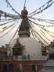 Typical Buddhist temple at sunset with flags a flyin'