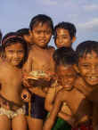 Group of young surf-lovers showing off their find