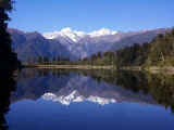 Snow capped peaks of Mt. Cook and Mt. Tasman over Lake Matheson