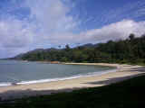 The pristine sands of the island's foliage-engulfed and practically deserted beaches