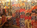 A shirt stall in the colorful and chaotic Temple Street night market